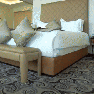 A drone dispersing dust or granules over a dry agricultural field, illustrating drone use in arid or early planting conditions.